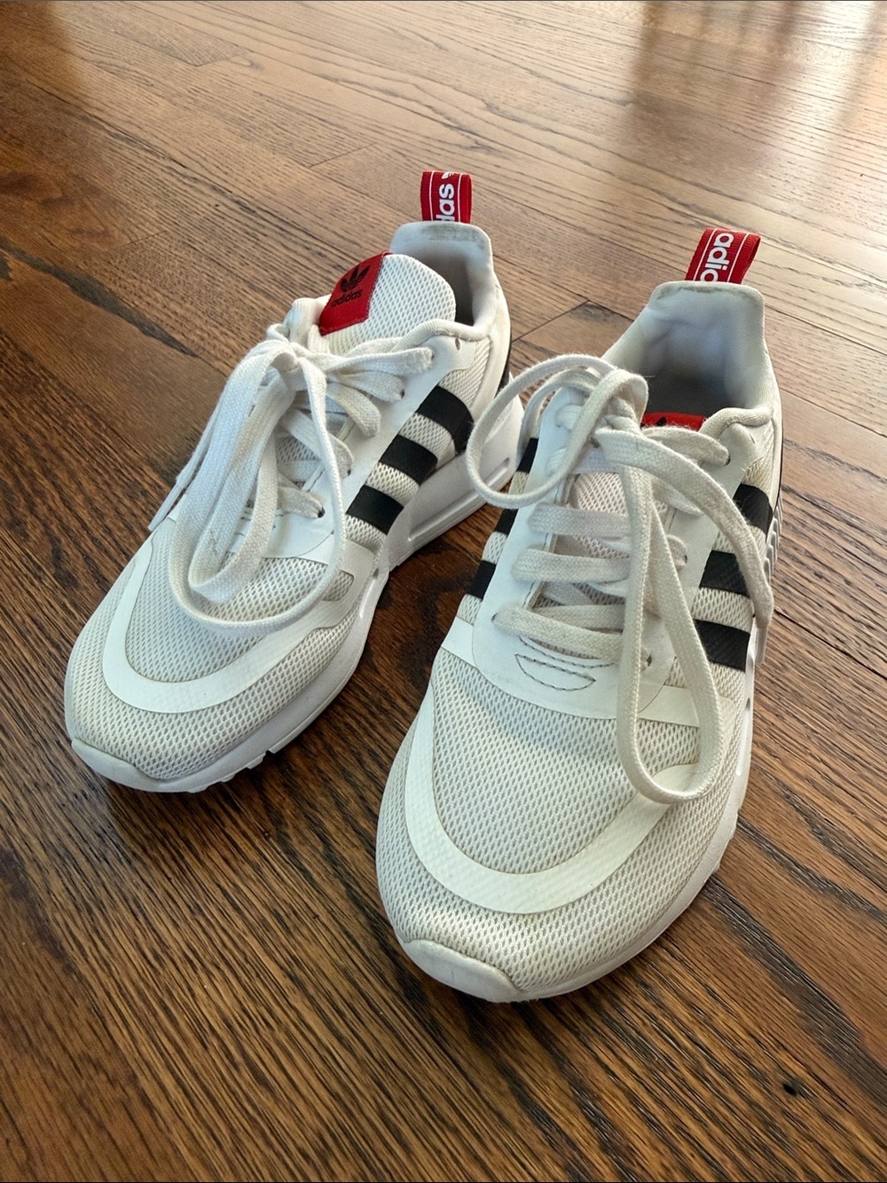 E adidas Kids 13.5 White Sneakers with Black Stripes and Red Heel Tabs